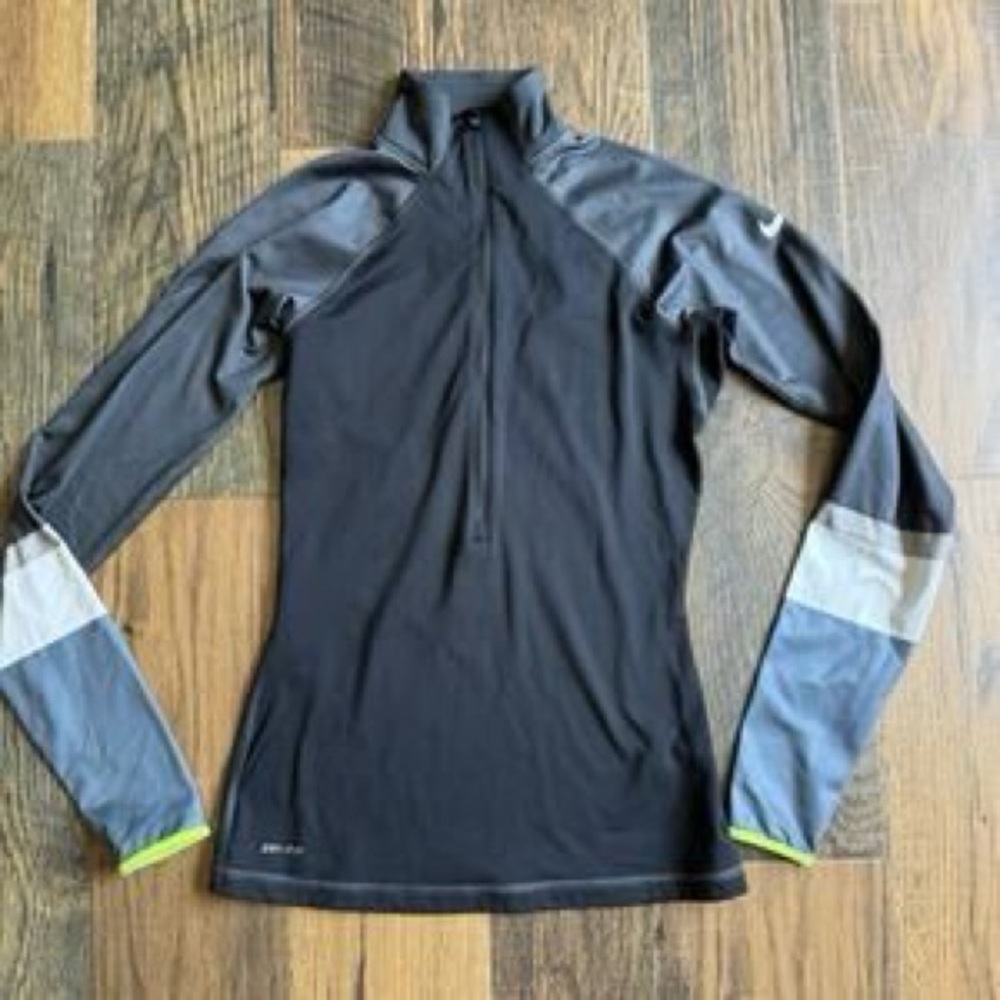Nike Pro Dri-FIT 1/4-Zip Pullover Top in black & gray with color-block cuffs.